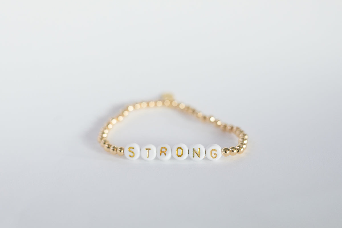 the gold bead word bracelet